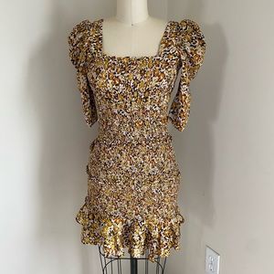 Small orange and yellow floral elastic mini dress.